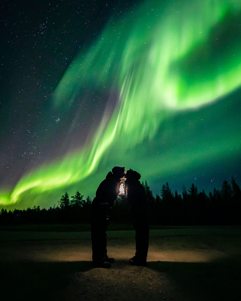 Kissing under the northern lights.